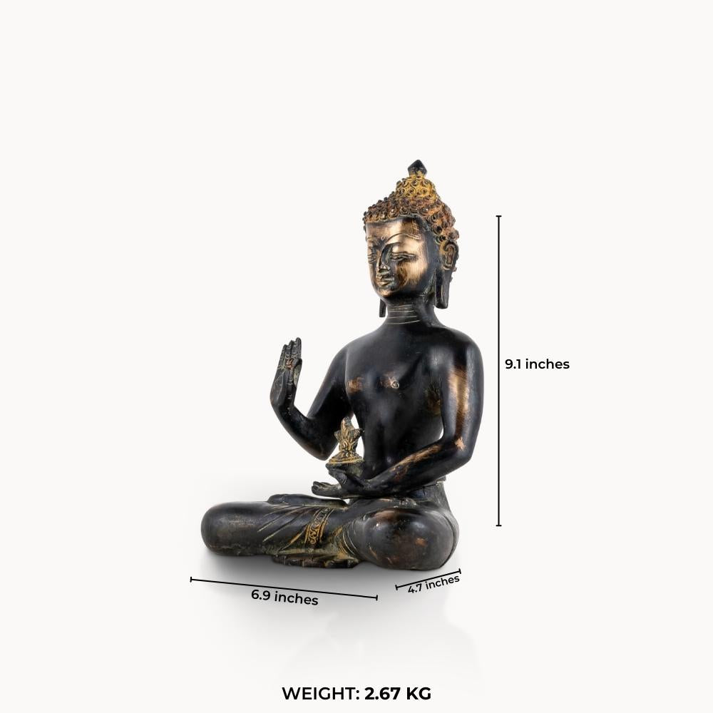Brass buddha in sitting position