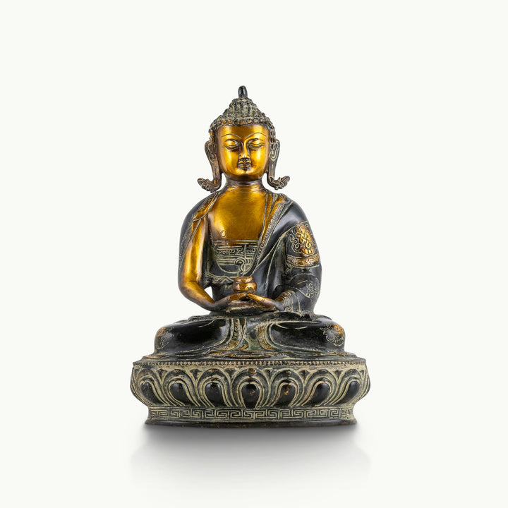 Dual-tone black brass Dhyana Buddha statue featuring a dark engraved robe and polished gold face