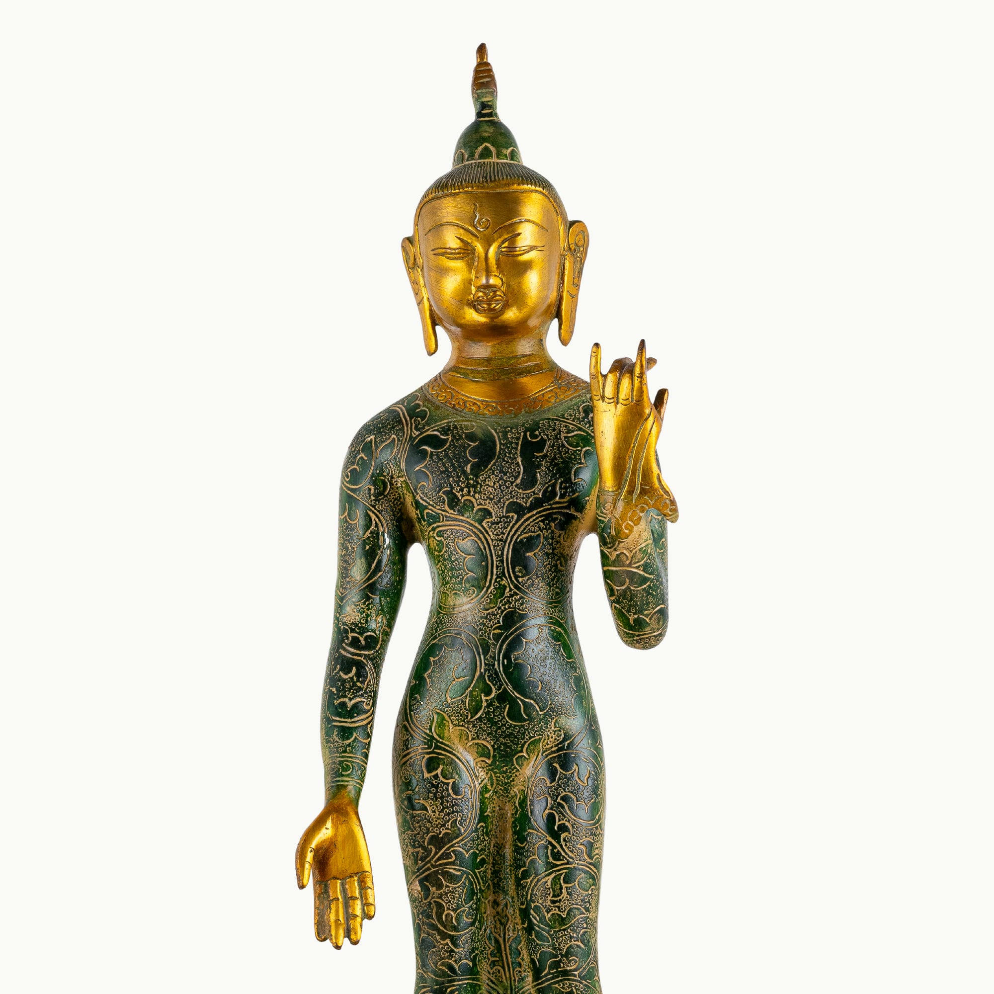 Tall standing dual-tone brass Buddha statue featuring a green engraved robe and polished gold face.