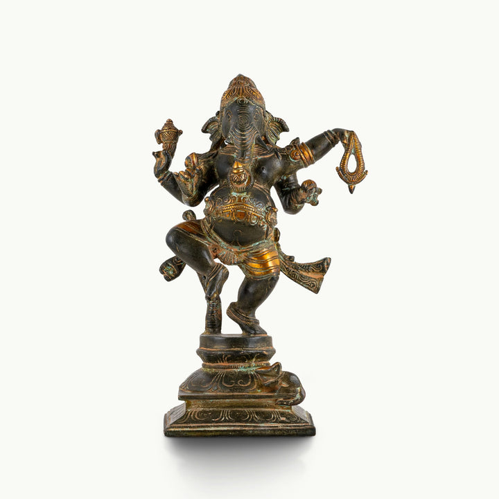 Oxidised brass dancing Ganesha statue in the rhythmic tandava pose on a double-lotus pedestal.