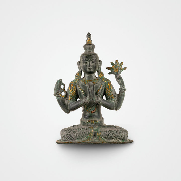 Four-Armed Brass Tara Statue meditating holding a lotus for a private study. 