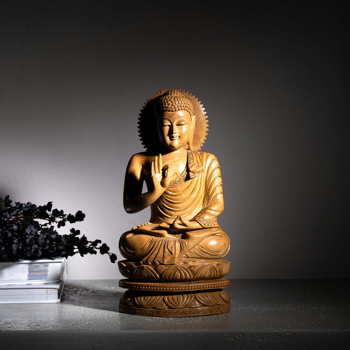Rosewood buddha in sitting position