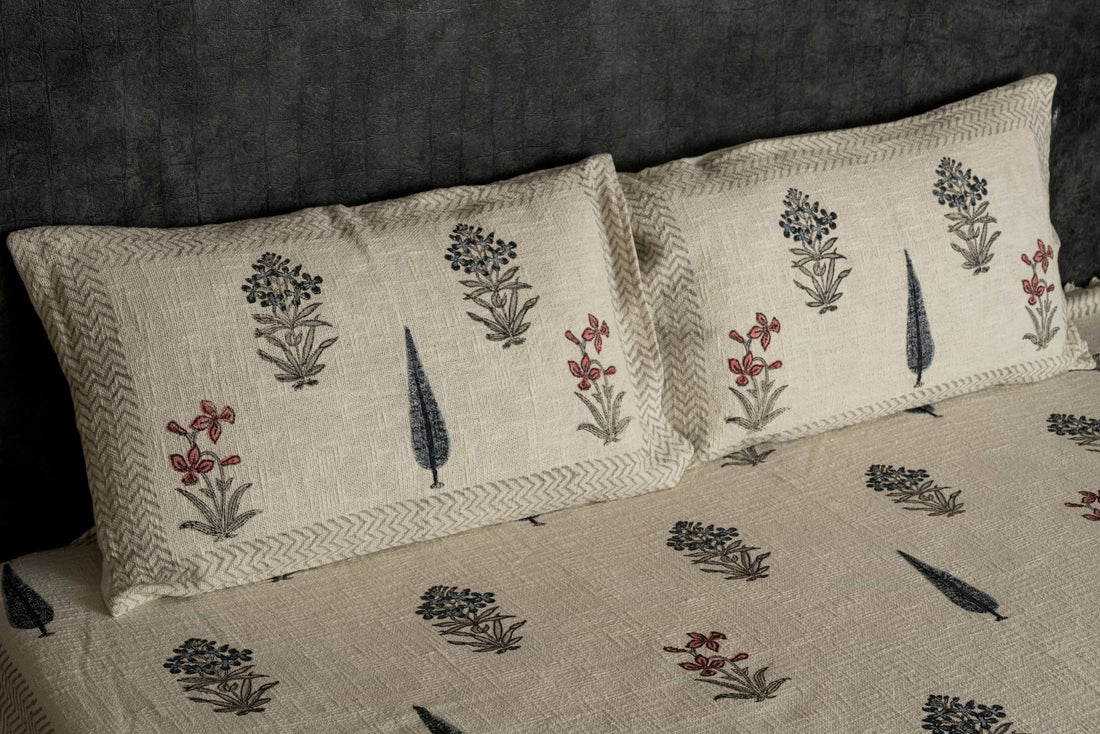 Hand-block printed cotton coverlet with scattered poppy and cypress motifs