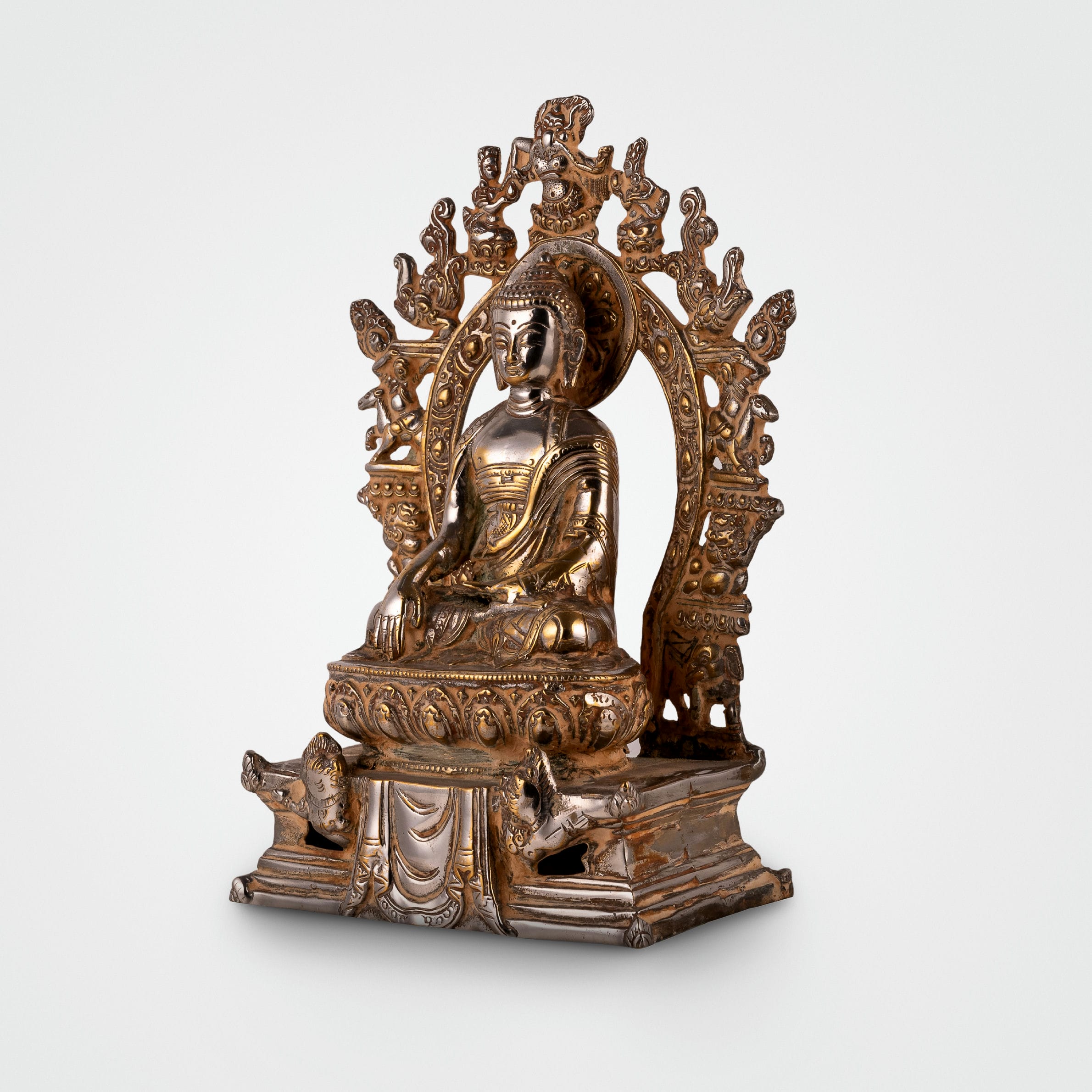 Handcrafted metal enlightened ascetic idol with an antiqued aureole for a meditation room centerpiece or spiritual housewarming gift.