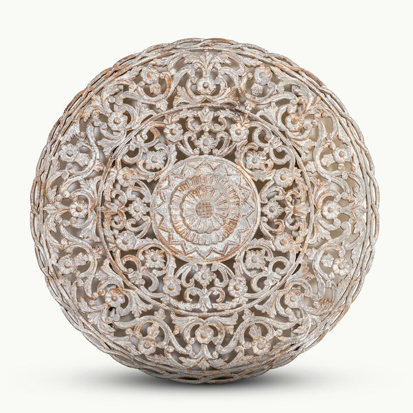 Whitewashed carved wooden mandala with distressed white finish and deep concentric patterns.