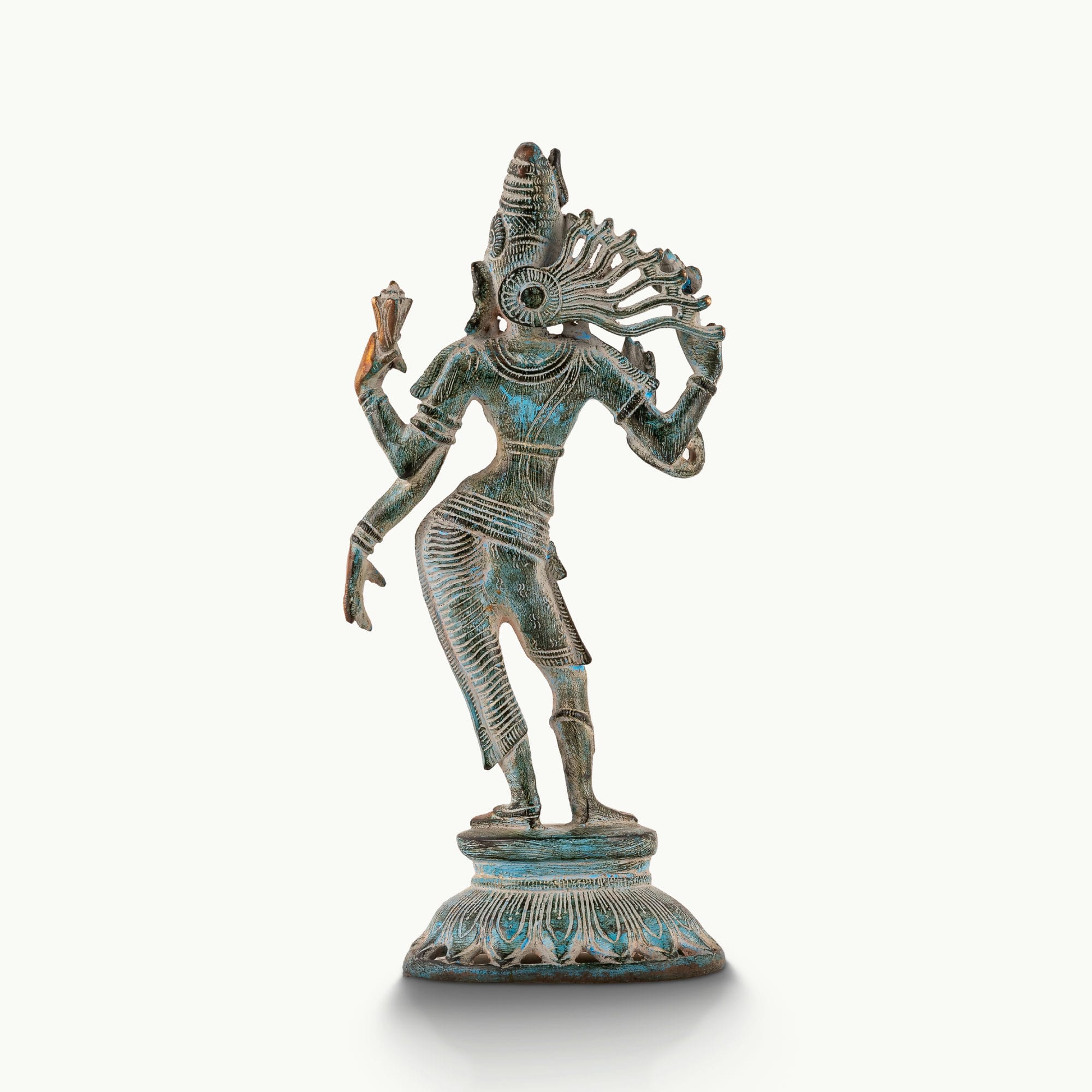 Dual-tone Shiva Shakti metal idol with a polished gold-tone face and teal patina for a foyer console or housewarming gift.