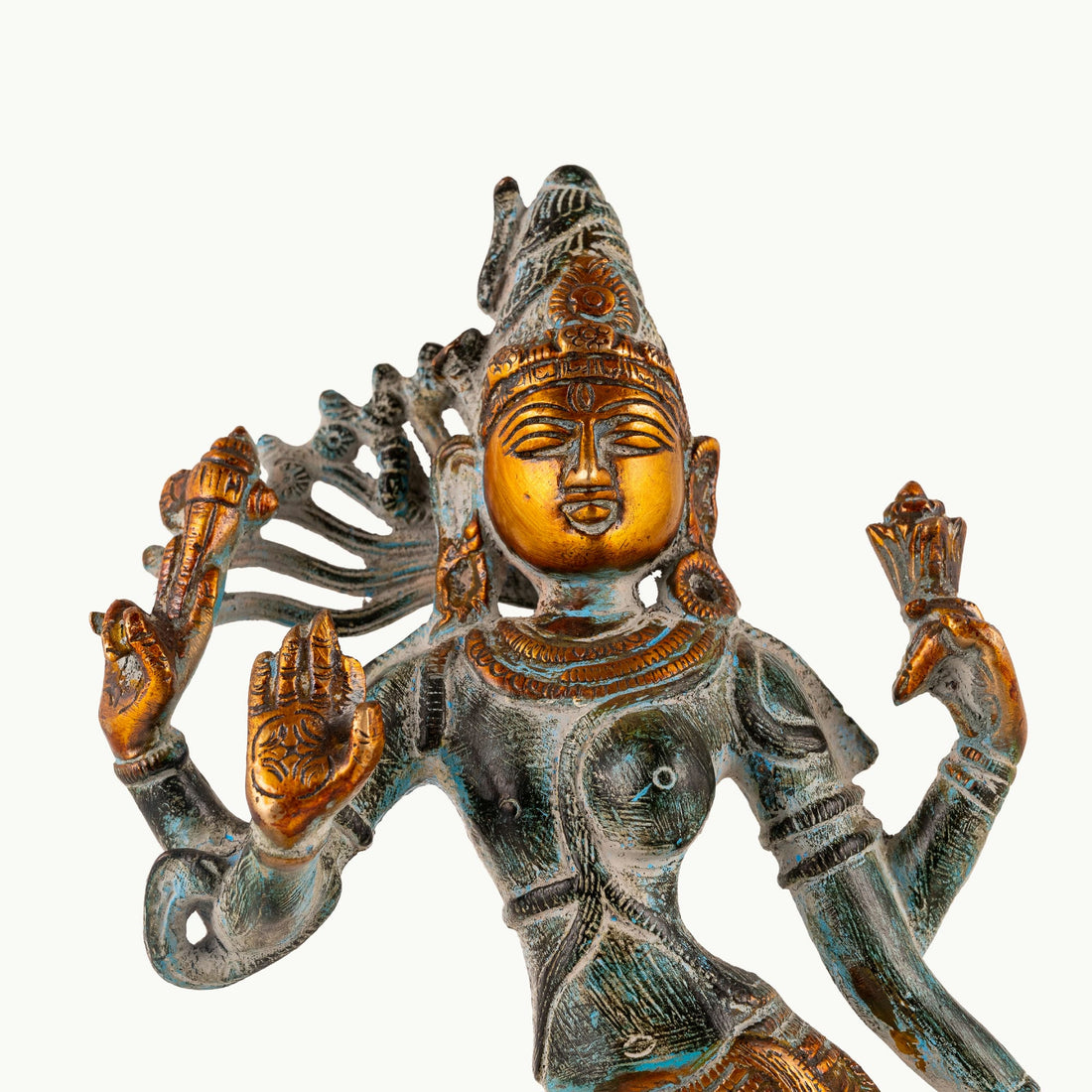 Dual-tone Shiva Shakti metal idol with a polished gold-tone face and teal patina for a foyer console or housewarming gift.