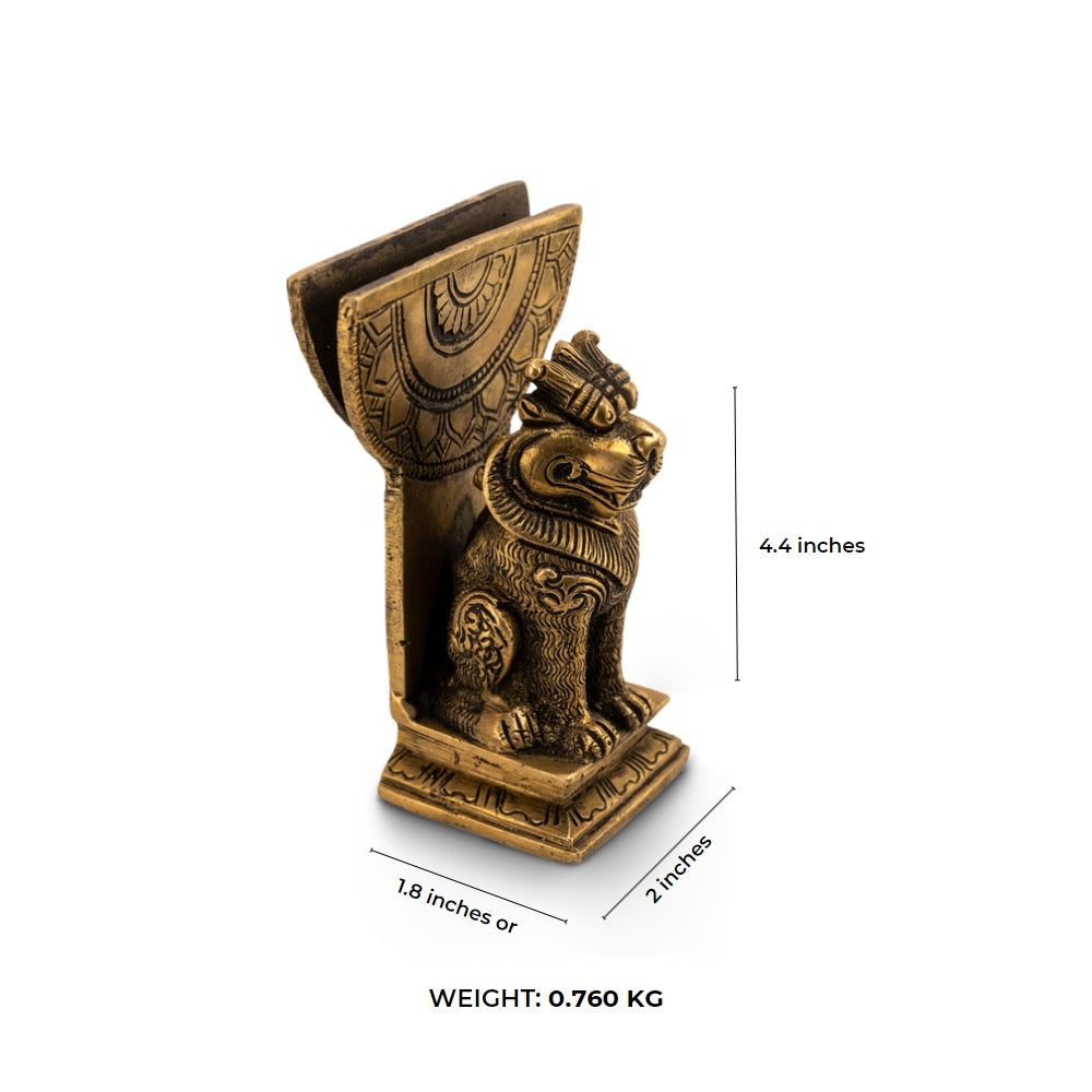 Antique Brass Lion Card Holder standing as a stoic authority on a modern glass console. 