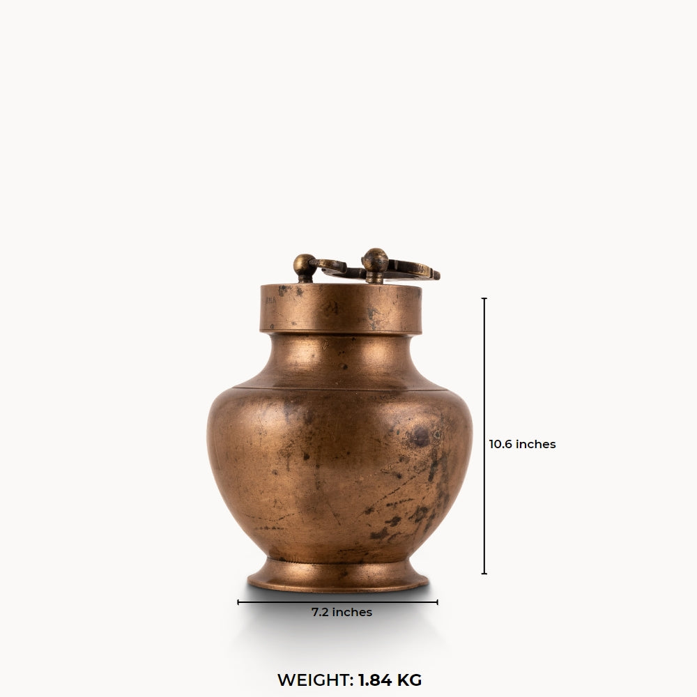 Antique Brass Locking Urn equipped with a dual-pin lid for a rustic reclaimed wood console.