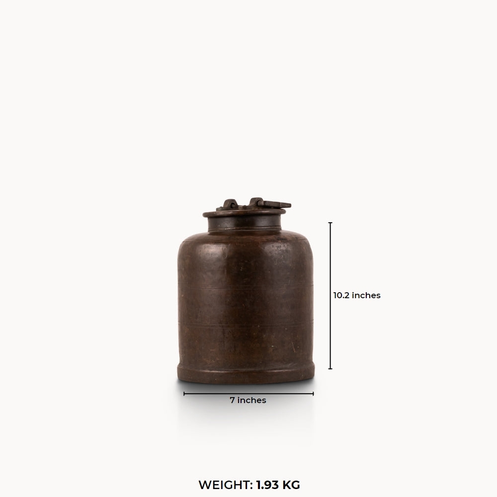 Antique Brass Canister secured by mechanical latches for a wood sideboard.