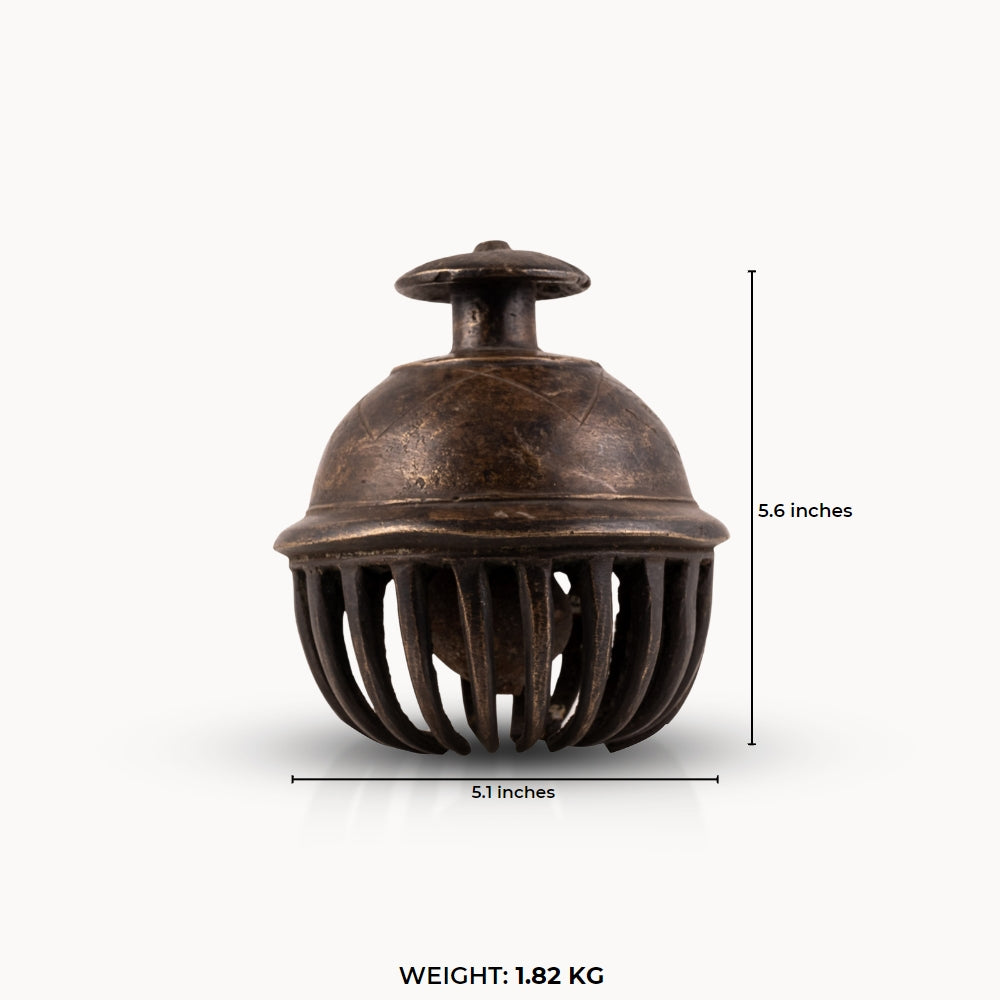 Antique Brass Elephant Bell enclosing a free-moving clapper for a walnut executive desk.