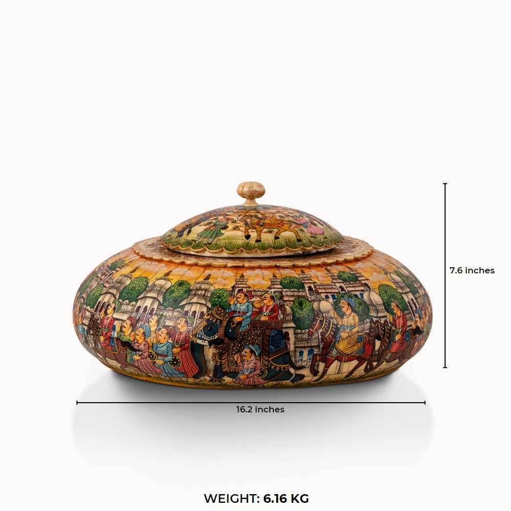 Painted round camel bone box featuring a vibrant royal procession scene bathed in a golden-amber wash.