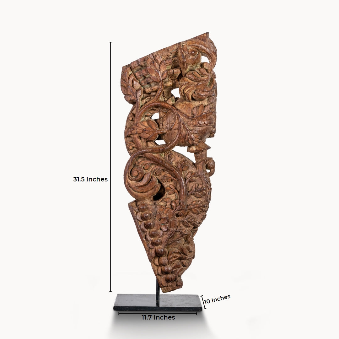 Carved wooden haveli bracket featuring a mythological avian sentinel.