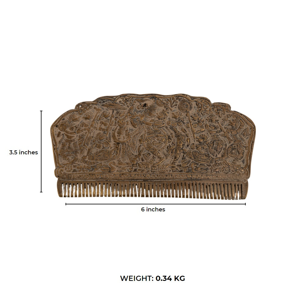 Engraved Brass Decorative Comb displaying a dense narrative tapestry on a mirrored dressing table. 