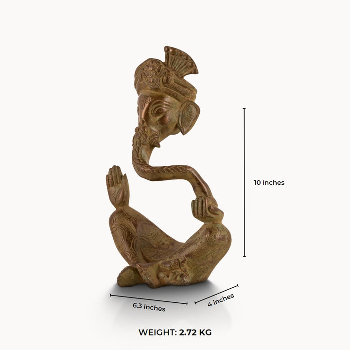 Antique abstract brass ganesha in meditative pose with turban