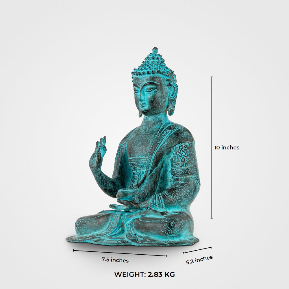 Hand-engraved Tibetan meditation idol with a striking teal patina for a living room mantle or Vastu alignment.