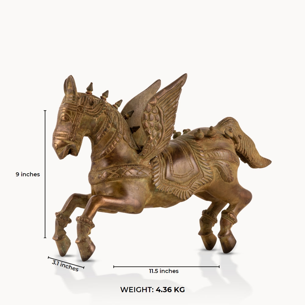 Brass Winged Horse Sculpture captured in a dynamic prancing gallop on a home library console. 