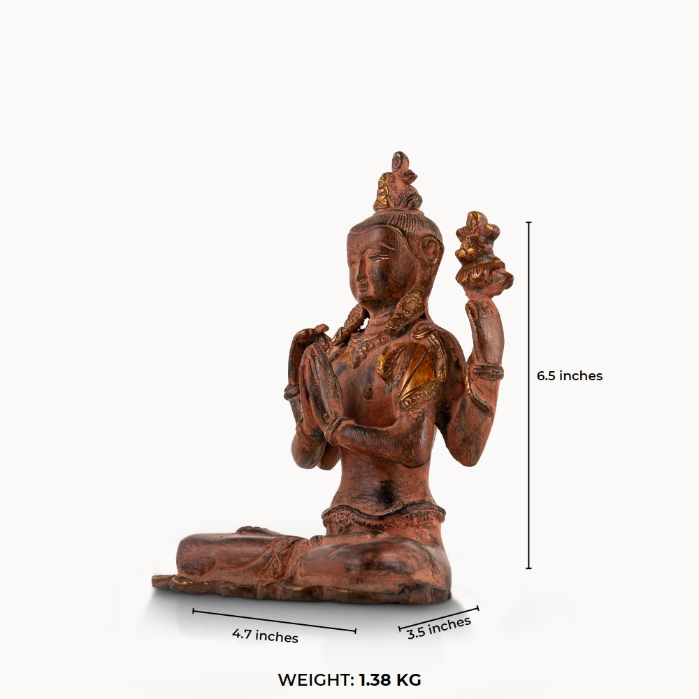 Red Oxidized Brass Tara Statue showing four arms of compassion on an east-facing meditation altar. 