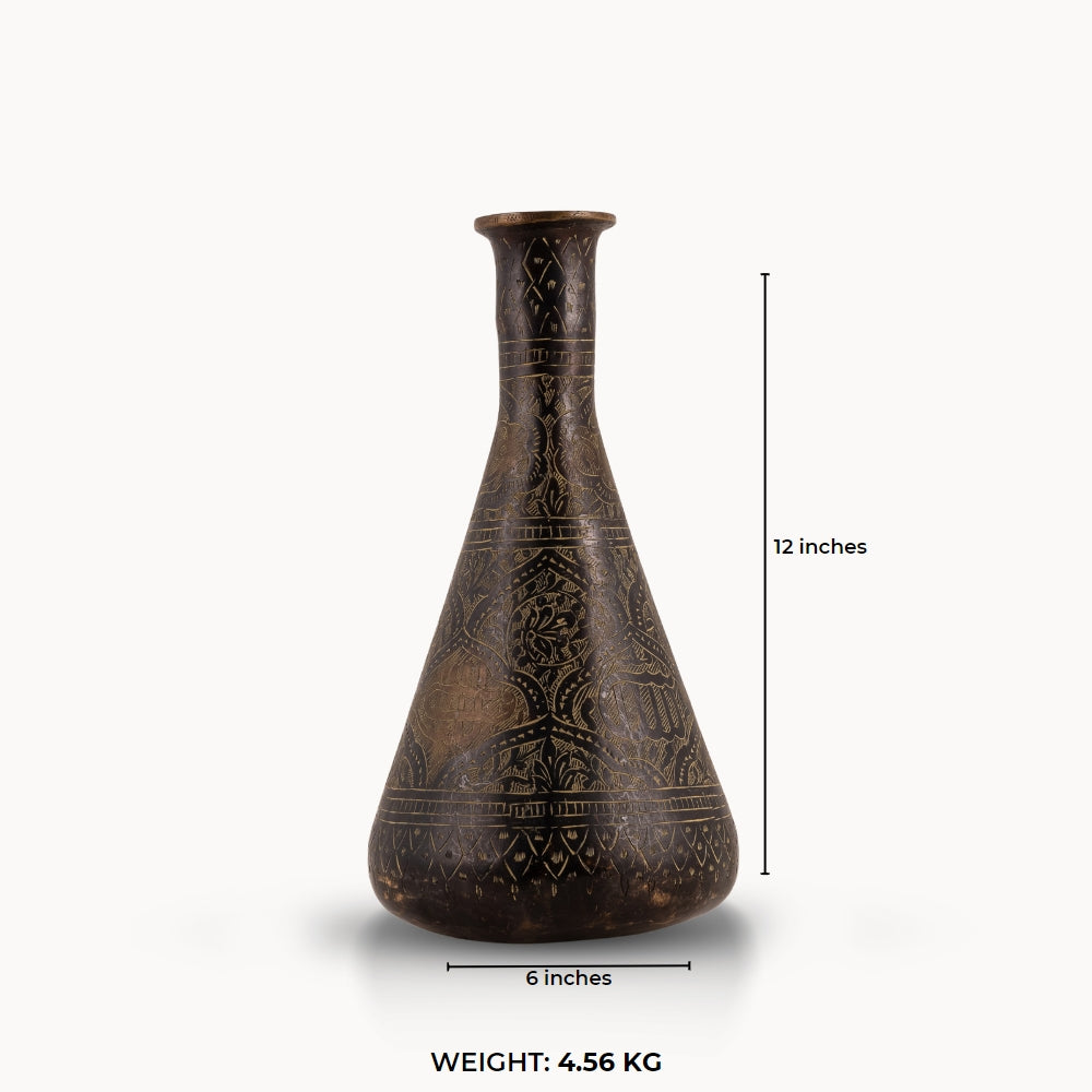 Engraved Brass Decorative Vase showcasing intricate stonework motifs on a neutral room console. 