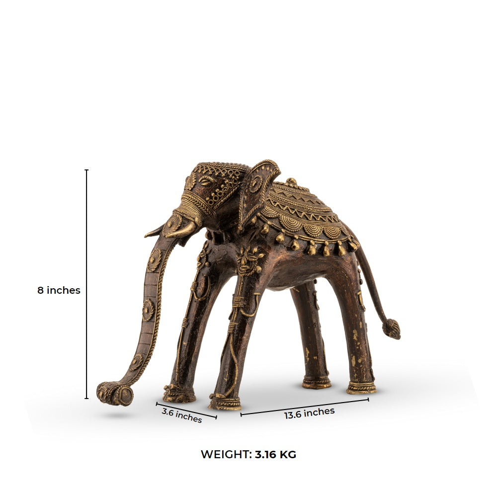 Indian metal ceremonial beast decor featuring a stylized elongated trunk for a wide wooden bookshelf or traditional home decor.