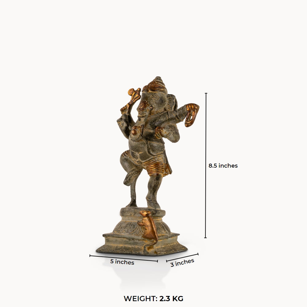 Verdigris Brass Dancing Ganesha Statue balancing effortlessly on a prominent entryway console. 