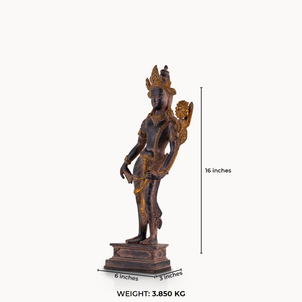 Dual-Tone Brass Padmapani Statue holding a blooming lotus stem on a minimalist entryway console. 
