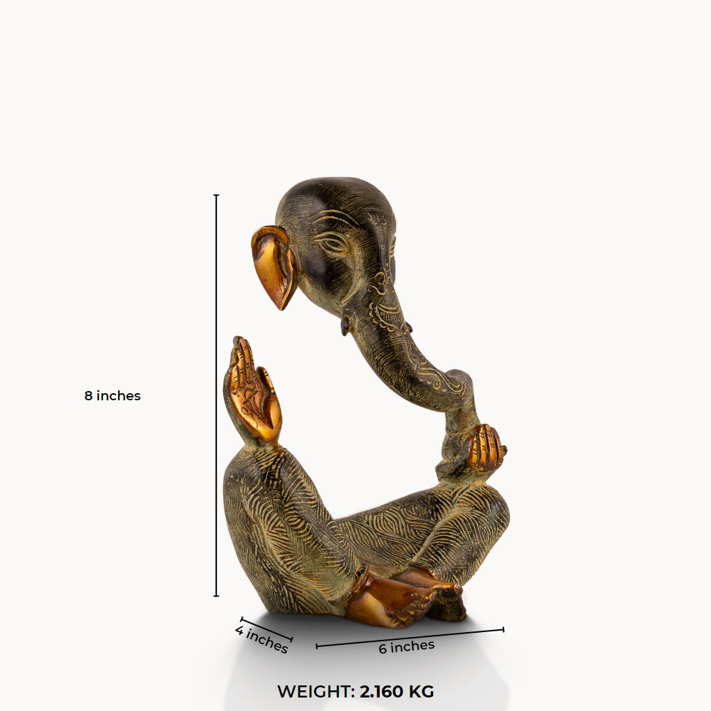 Abstract Brass Ganesha Sculpture displaying a floating torso on a light-wood console. 