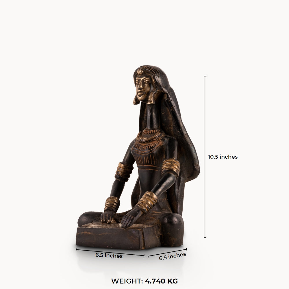 Tribal Brass Musician Sculpture playing a traditional box instrument for a minimalist console. 