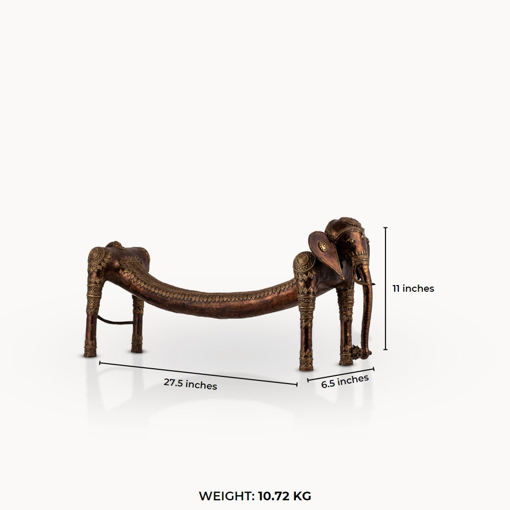 Elongated Dhokra Elephant Sculpture with a dipping back for a minimalist console.
